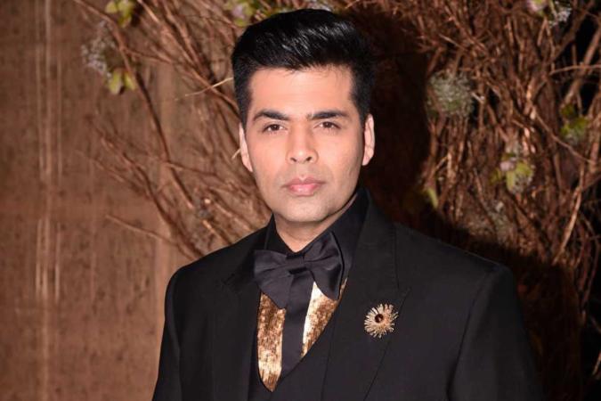 Did Karan Johar have to sell his shares of Dharma Productions?